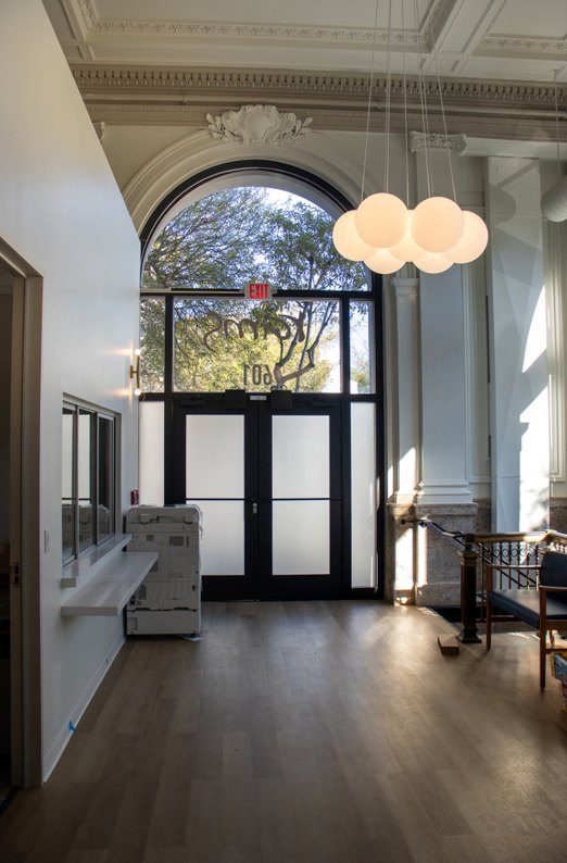 Arched window and frosted-glass entry