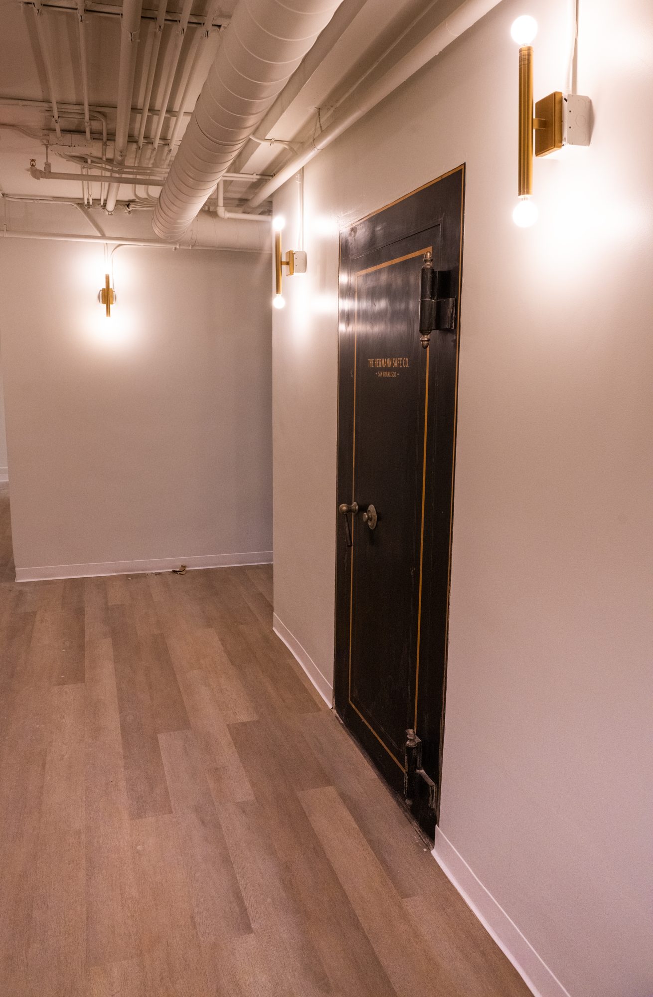 The bank's original vault door, kept in place on the lower level