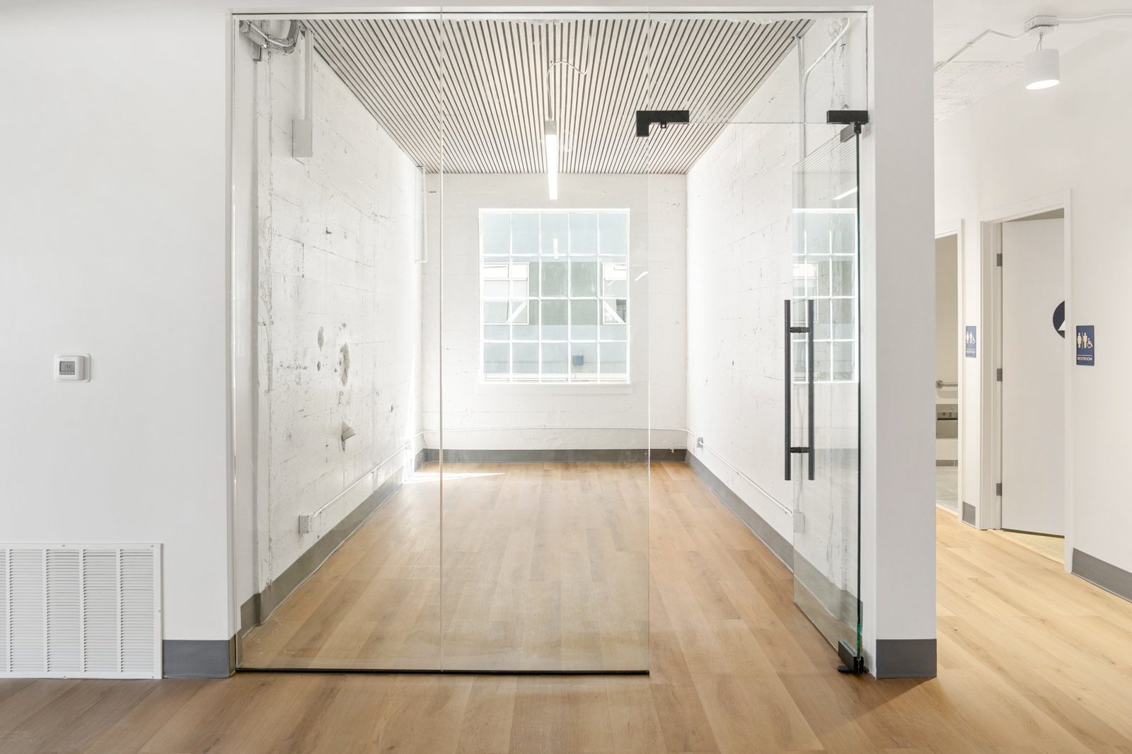 Glass-front conference room at Brannan St