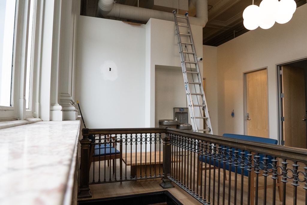 Mezzanine with the original iron railing and marble window sill