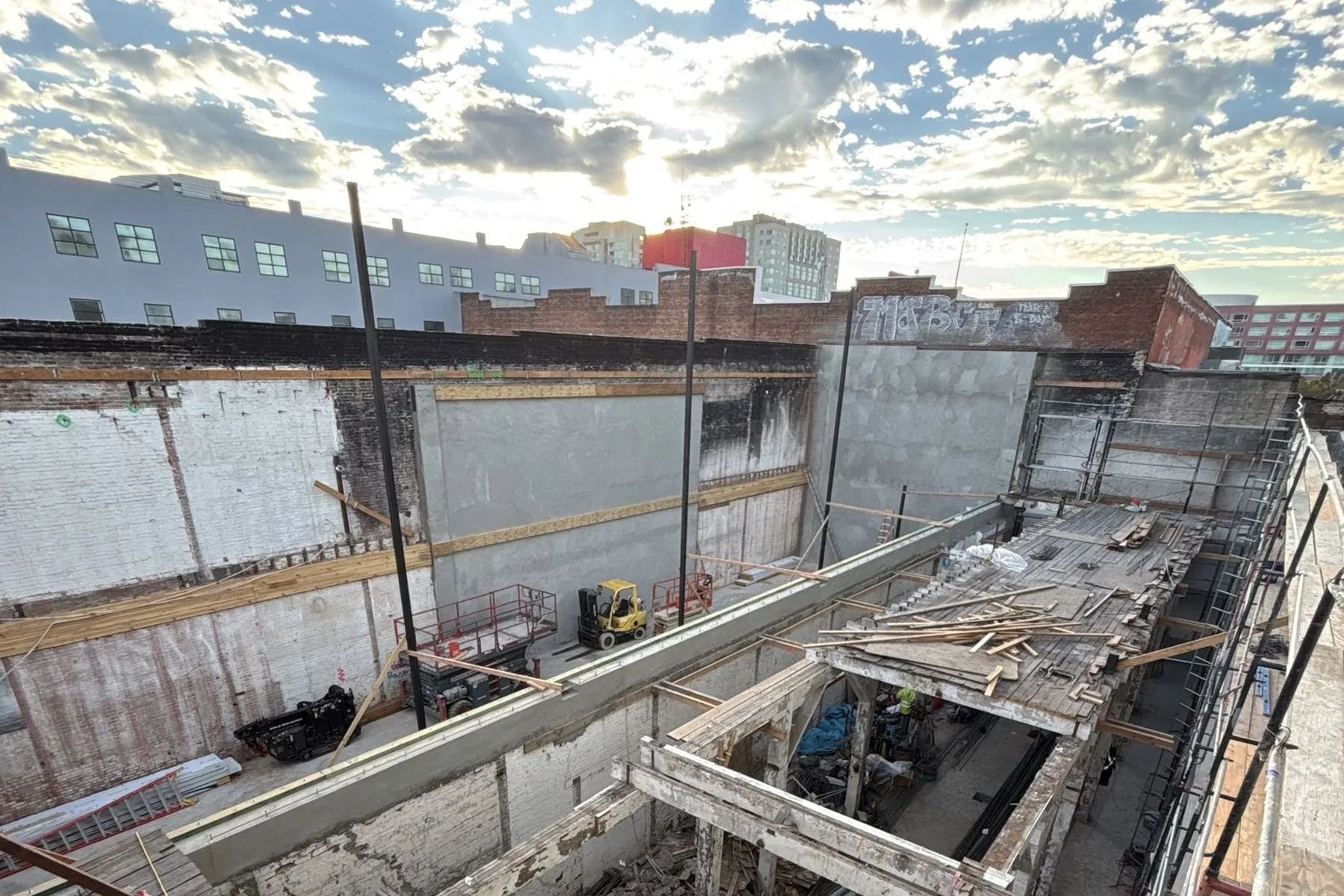 New structure rising inside the kept brick shell