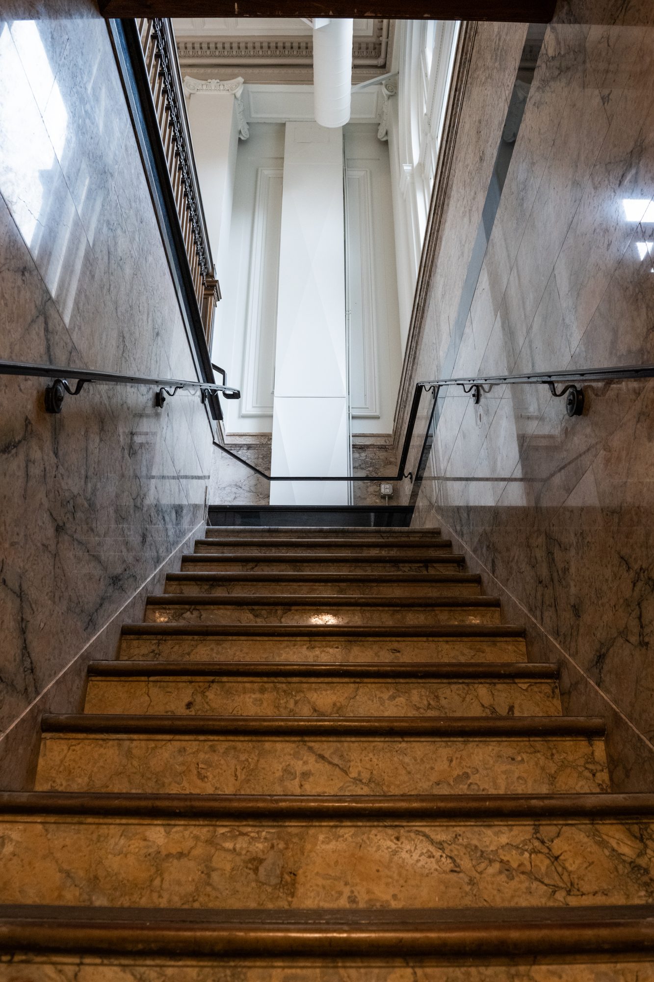 Original marble stair, retained, with new bronze handrails