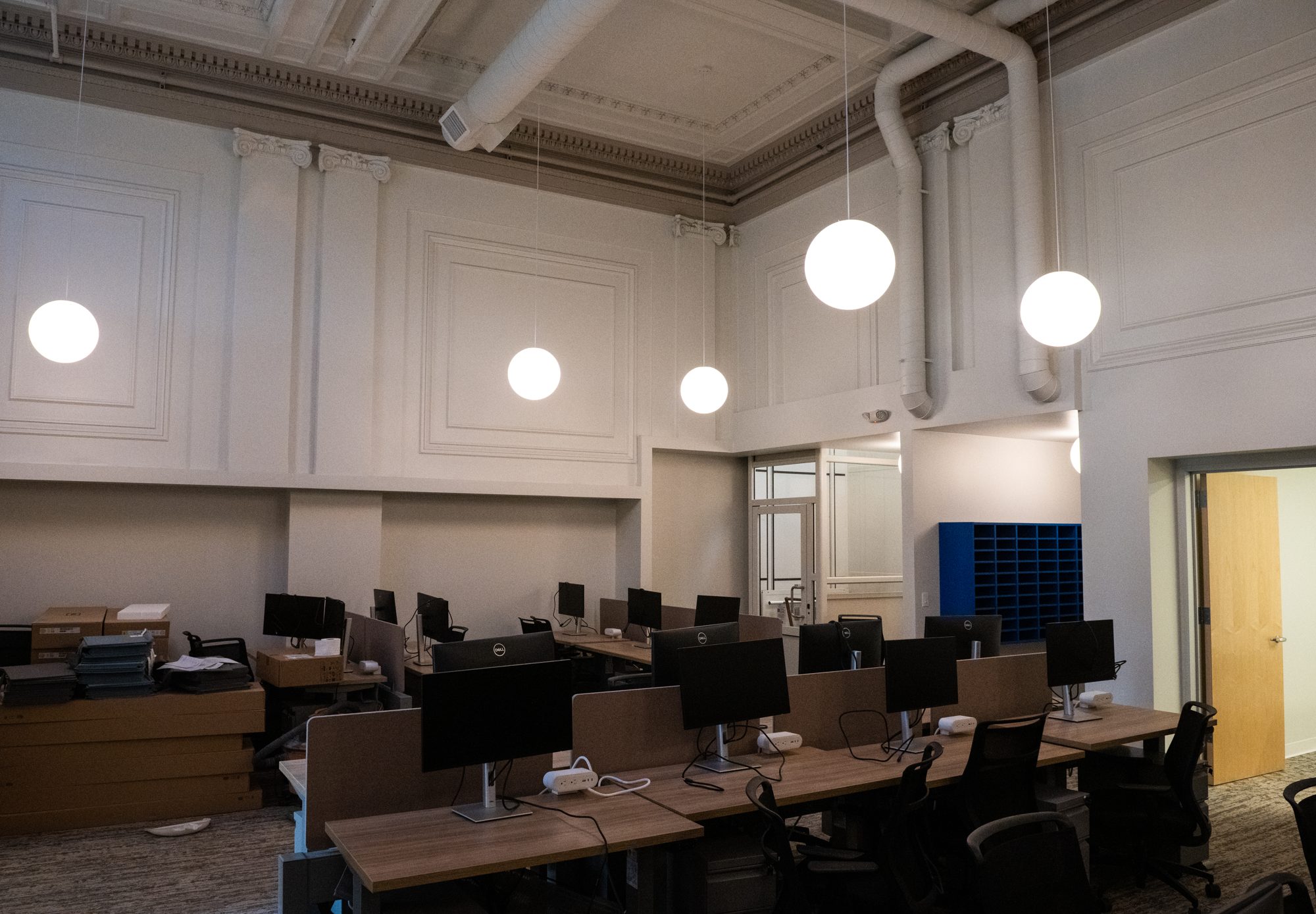 Workspace with the original plaster panel walls and new lighting